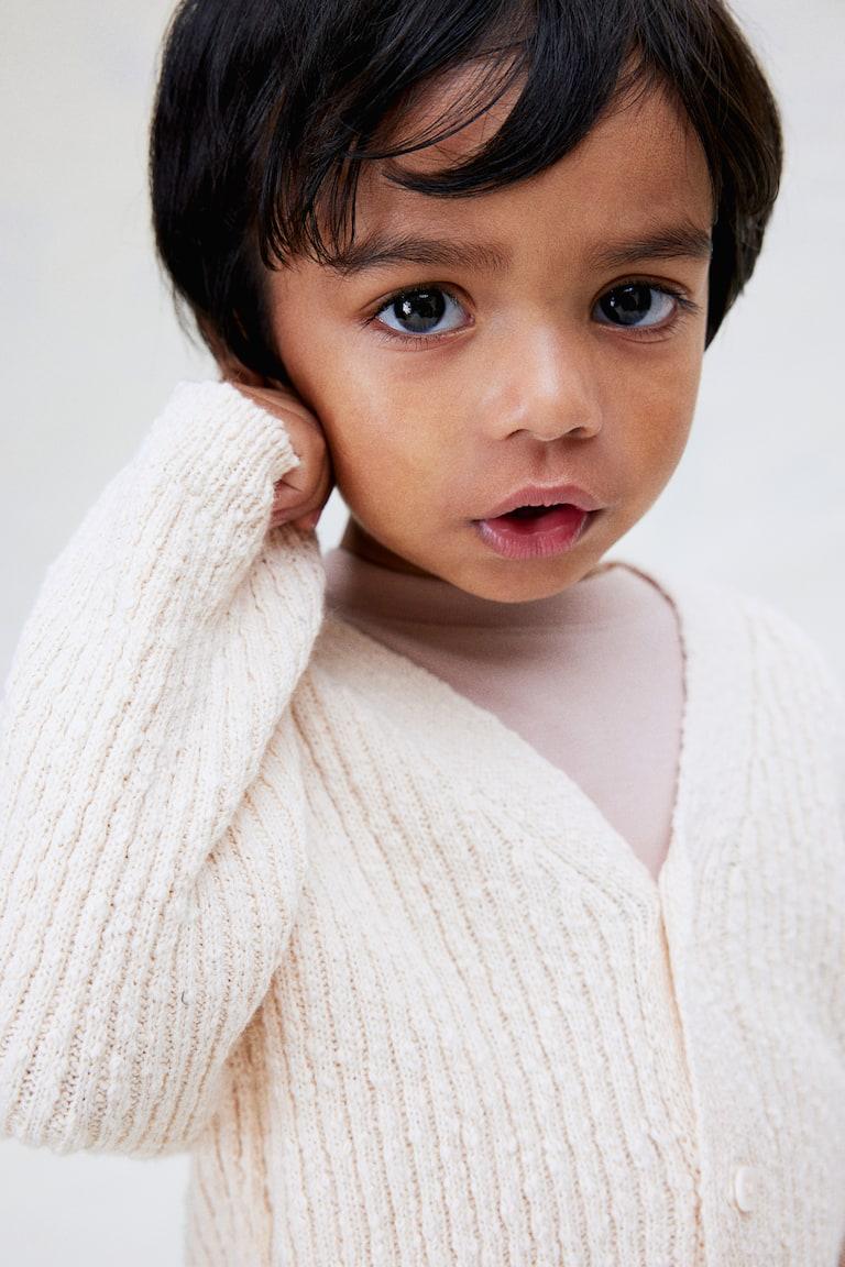H&M Oversized Cardigan aus Boucléstrick Blitzverkäufe