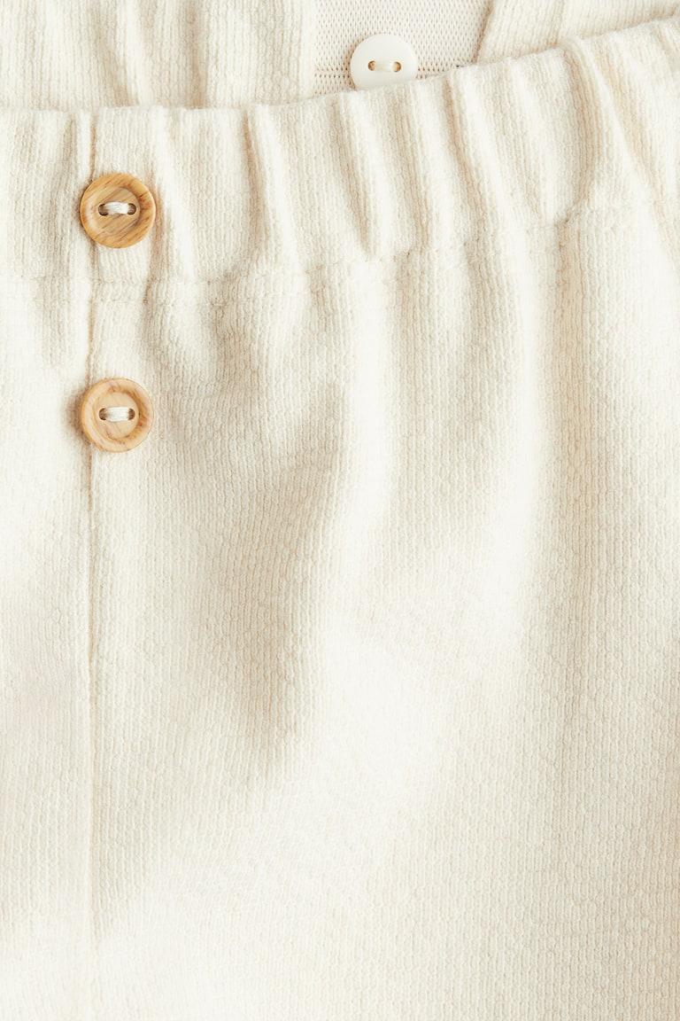 H&M Hose mit Zierknöpfen Jubiläumsangebot