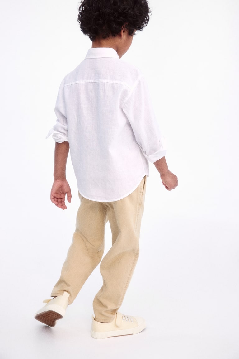 H&M Loose-fit tapered twill chinos Fabrik Onlineshop